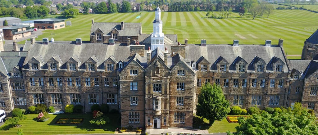 Aerial view of a cricket ground and school buildings used for Northern Reivers cricket coaching and development programme